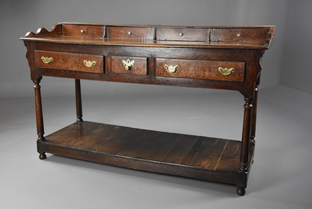 Mid 18th century oak potboard dresser base of superb patina View IV