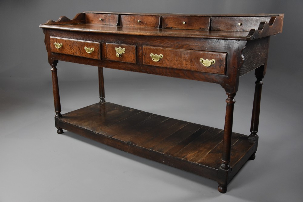 Mid 18th century oak potboard dresser base of superb patina View V