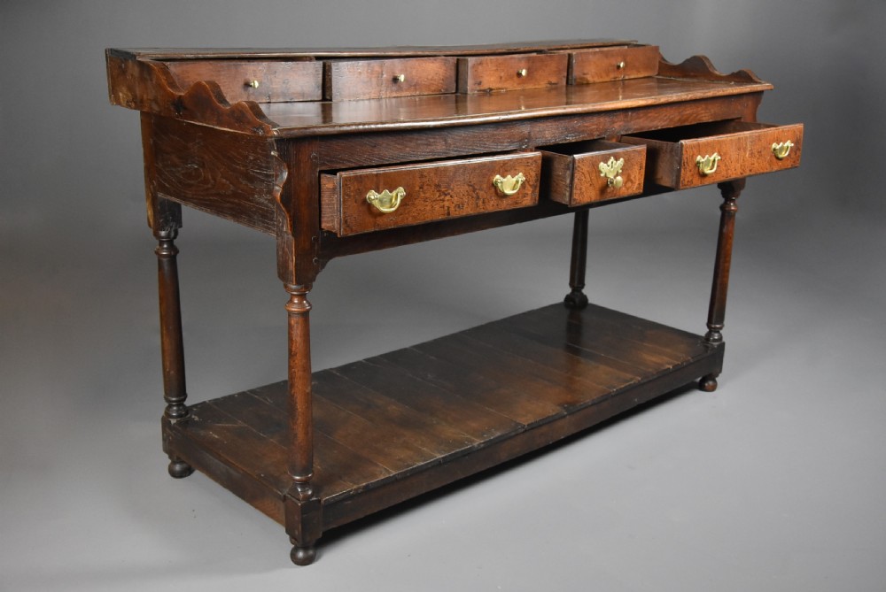 Mid 18th century oak potboard dresser base of superb patina View VIII