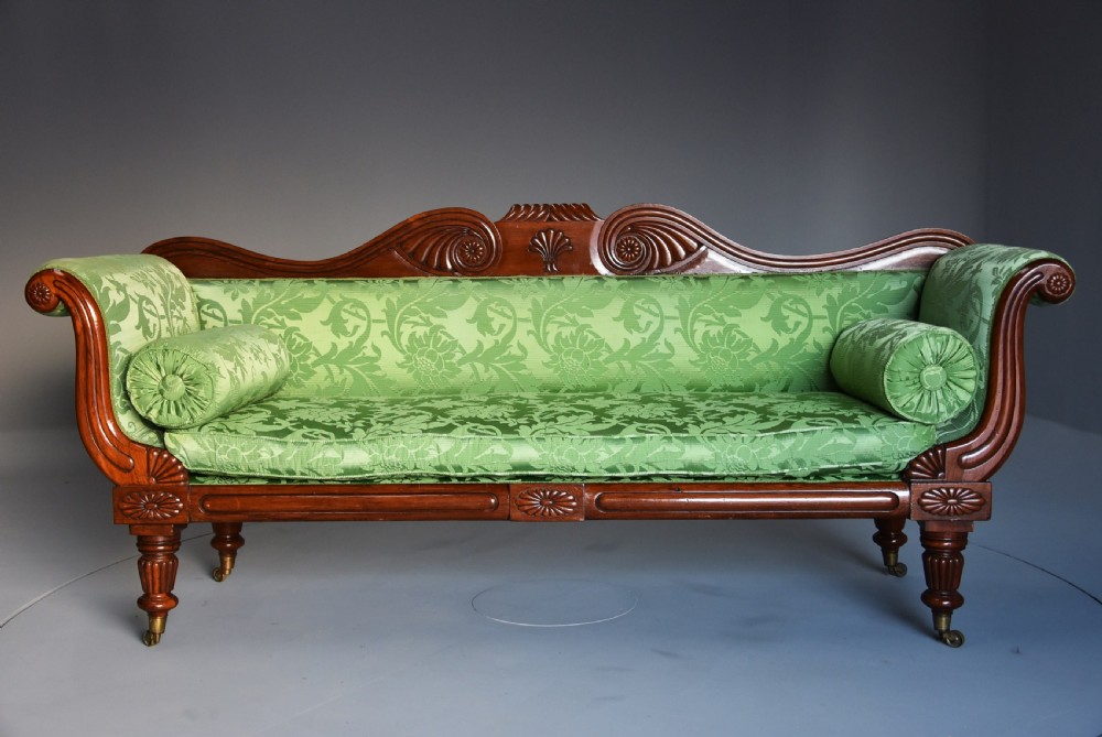 19th century late Regency scroll end mahogany sofa upholstered in green silk fabric