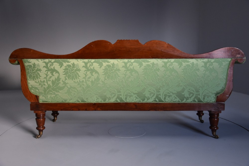 19th century late Regency scroll end mahogany sofa upholstered in green silk fabric View X