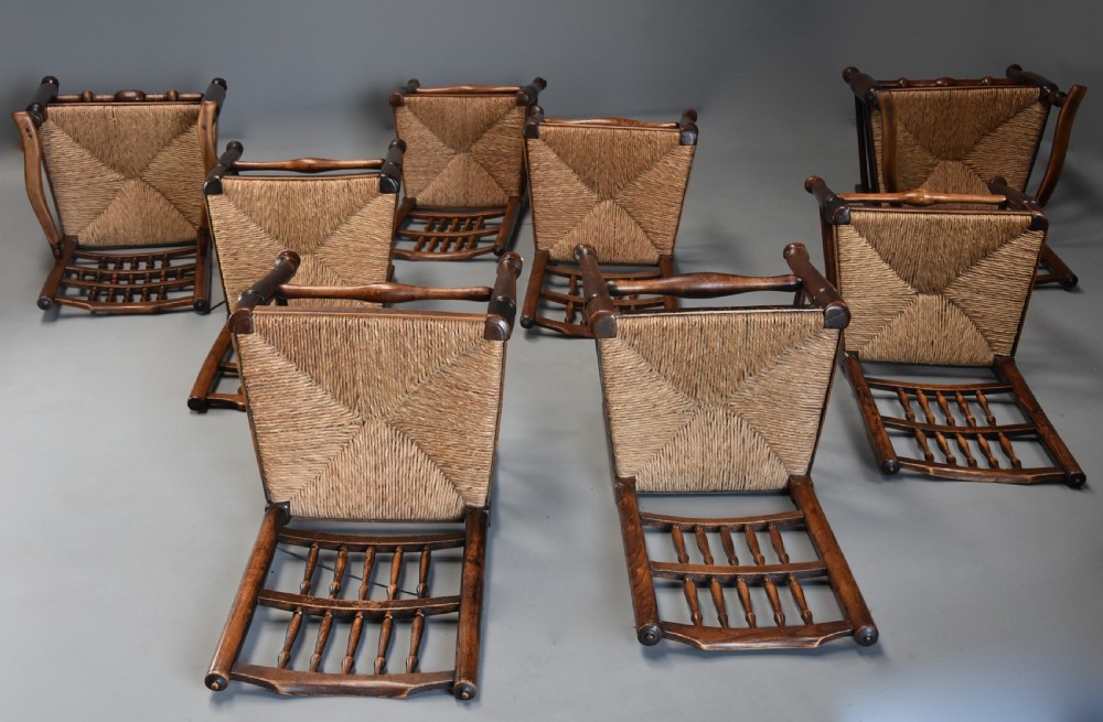 Matched set of eight mid 19th century ash spindle back chairs of superb patina View XI