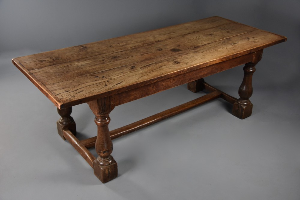 A late 19th century Arts & Crafts oak refectory table with superb faded patina