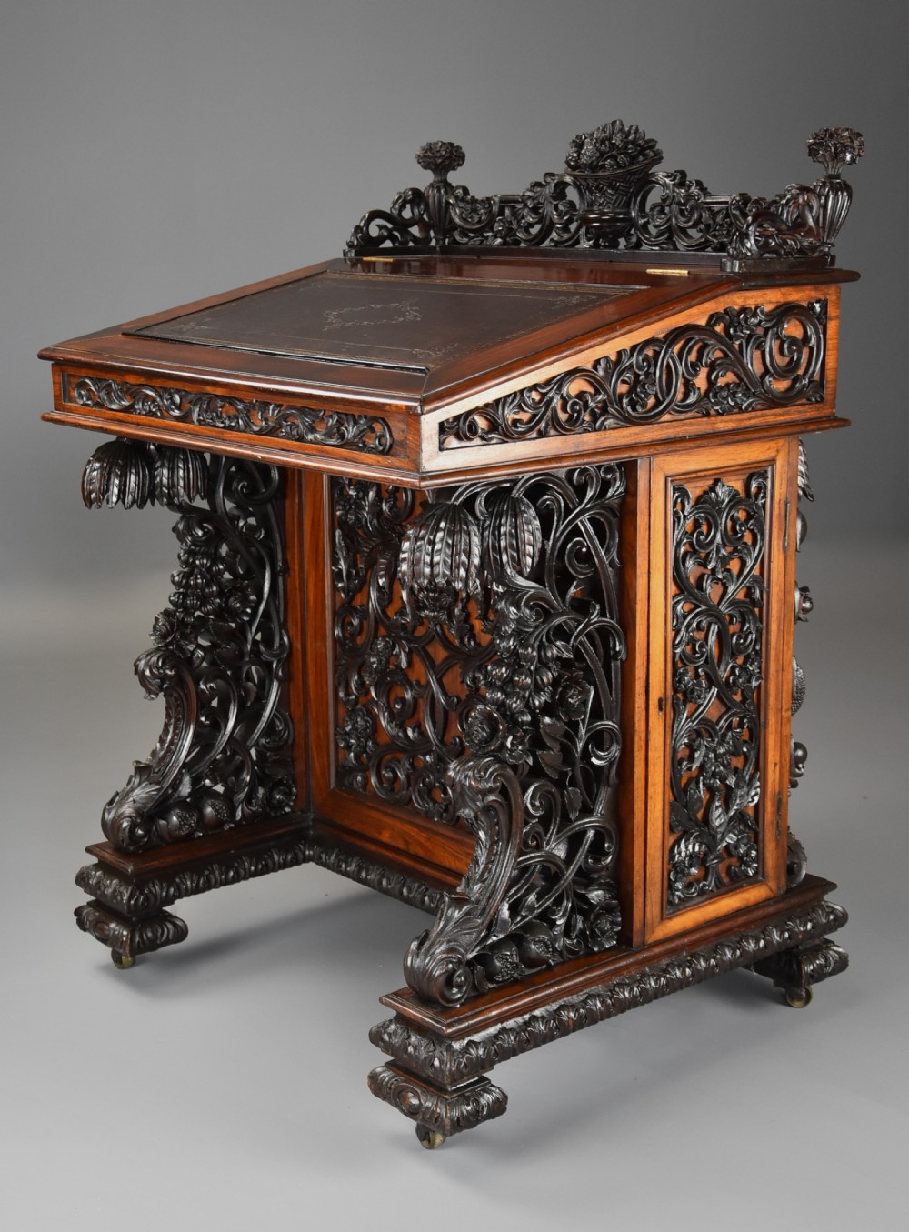 Exquisite mid 19thc Anglo Indian padouk & satinwood profusely carved freestanding davenport of large scale
