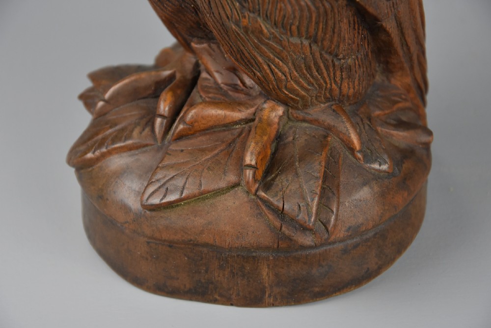 Finely carved 19thc Black Forest linden wood storage jar in the form of an owl View IX