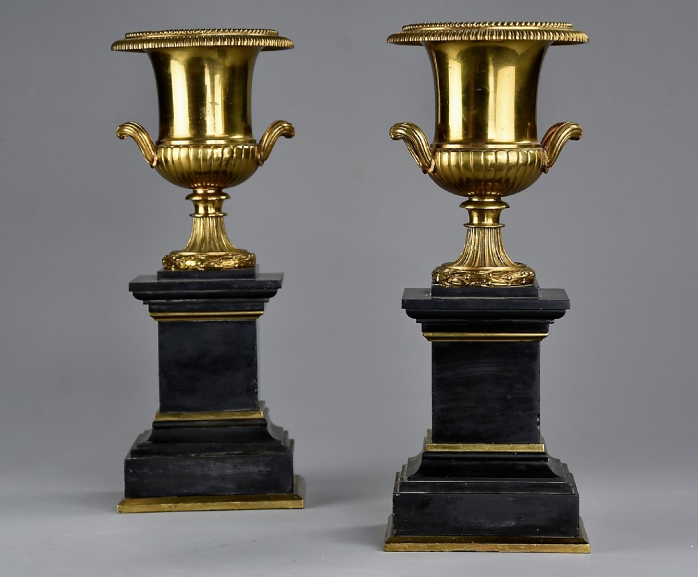 Highly decorative pair of French late 19thc brass campana urns on slate bases