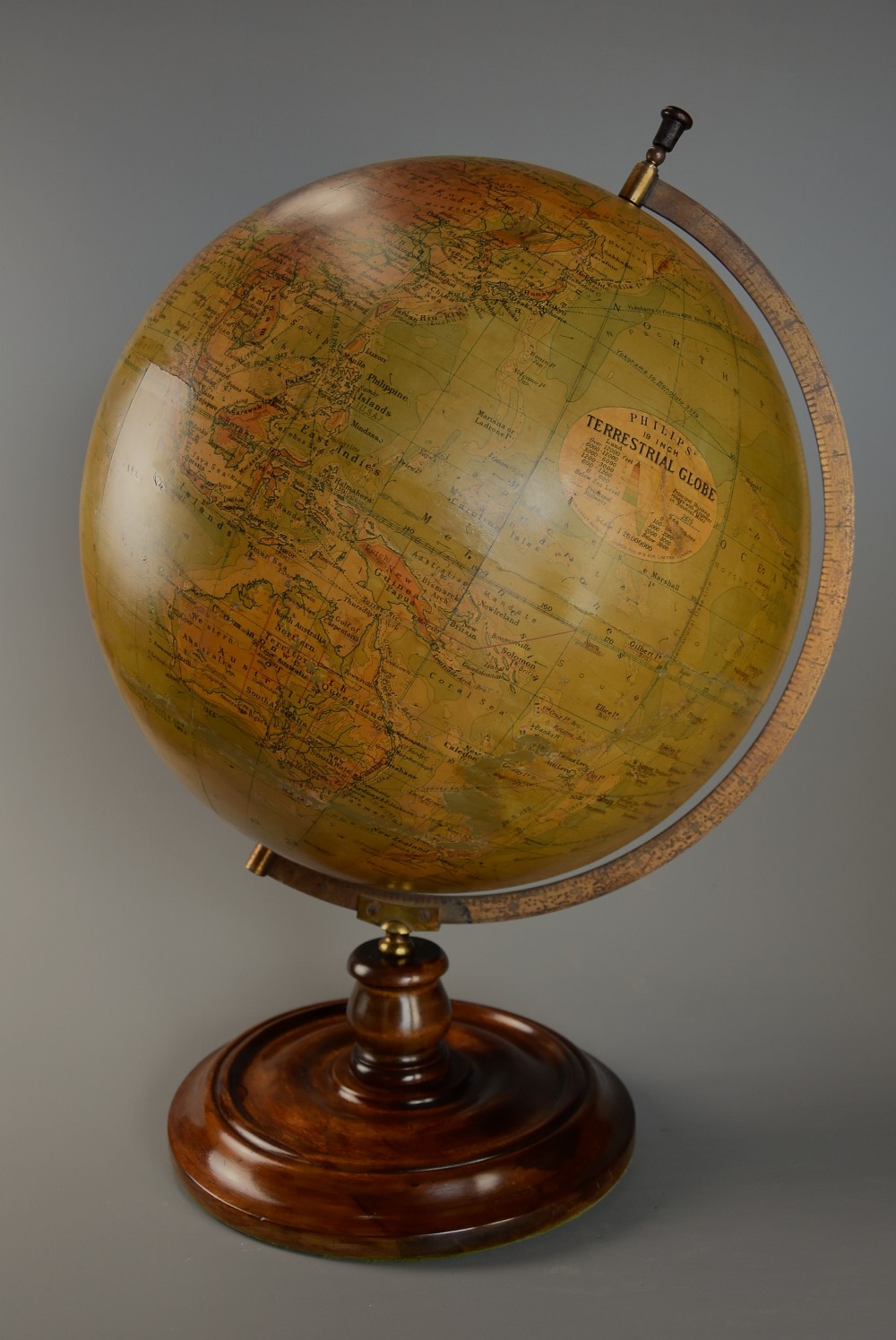 Early 20thc Philips 19 inch terrestrial table globe supported on walnut base