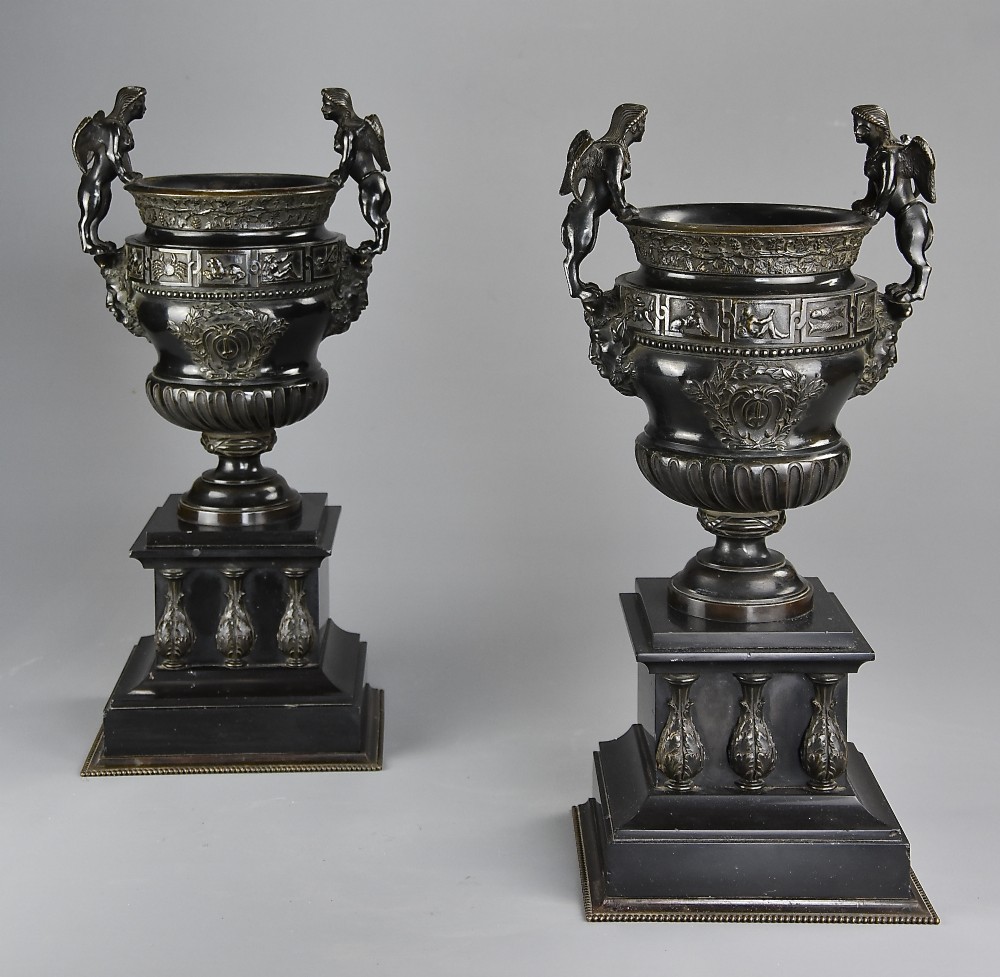 Pair of late 19thc bronze urns after a design of a pair of urns at The Palace of Versailles 