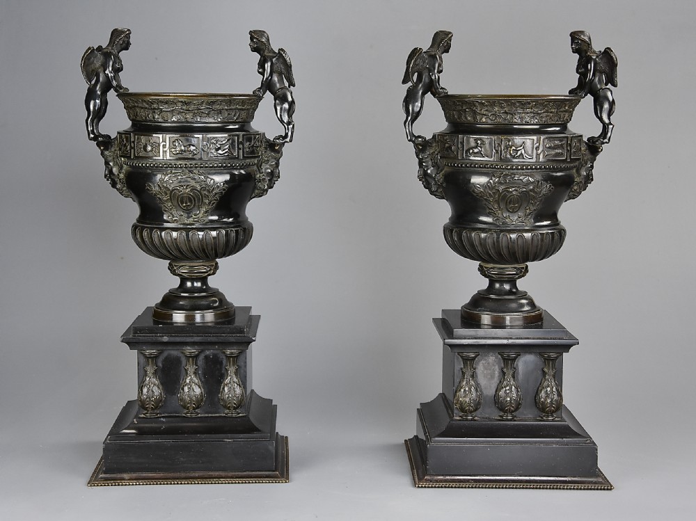 Pair of late 19thc bronze urns after a design of a pair of urns at The Palace of Versailles  View II