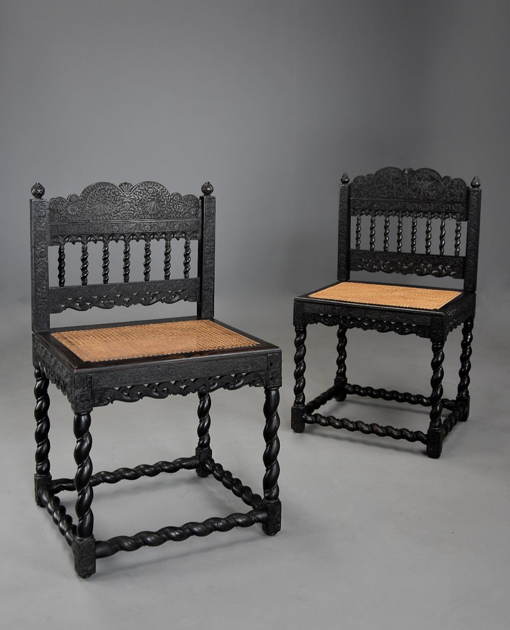 Superb quality matched pair of mid 17thc solid ebony carved chairs from The Coromandel Coast, India