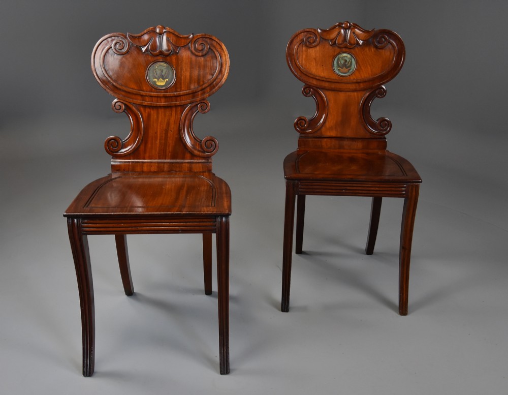 Pair of early 19th century Regency mahogany hall chairs of fine patina