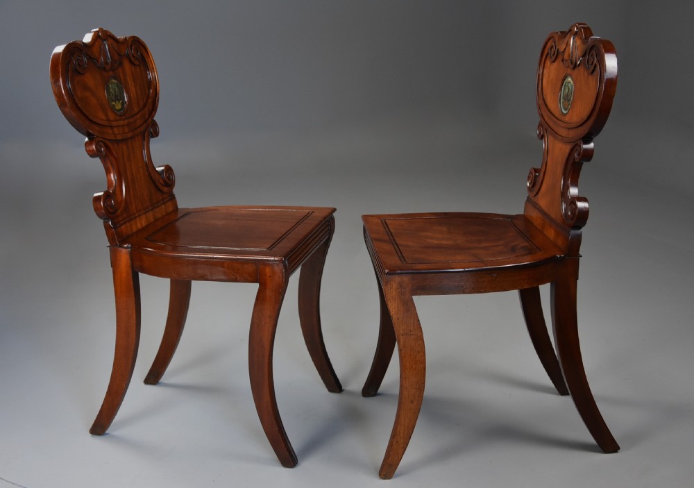 Pair of early 19th century Regency mahogany hall chairs of fine patina View VI