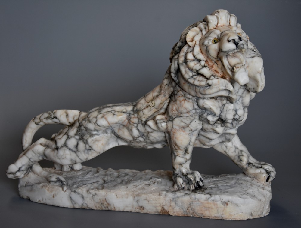 Highly decorative French Art Deco carved marble sculpture of a roaring male lion