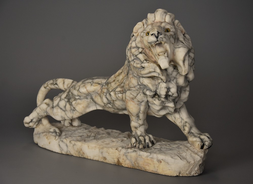 Highly decorative French Art Deco carved marble sculpture of a roaring male lion View II