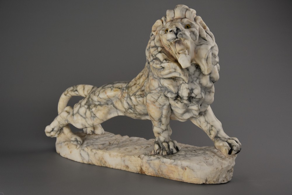 Highly decorative French Art Deco carved marble sculpture of a roaring male lion View III
