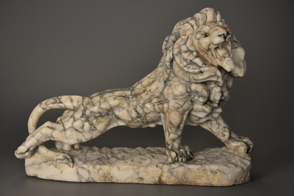 Highly decorative French Art Deco carved marble sculpture of a roaring male lion View IV