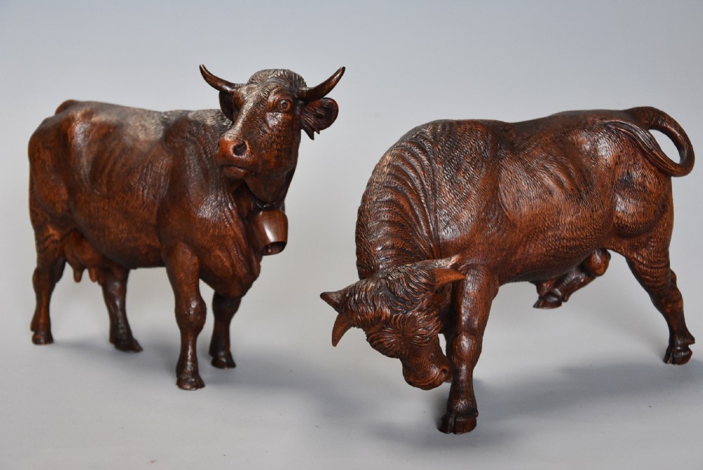 Pair of finely carved late 19th century linden wood Black Forest cows, possibly by The Huggler family View II