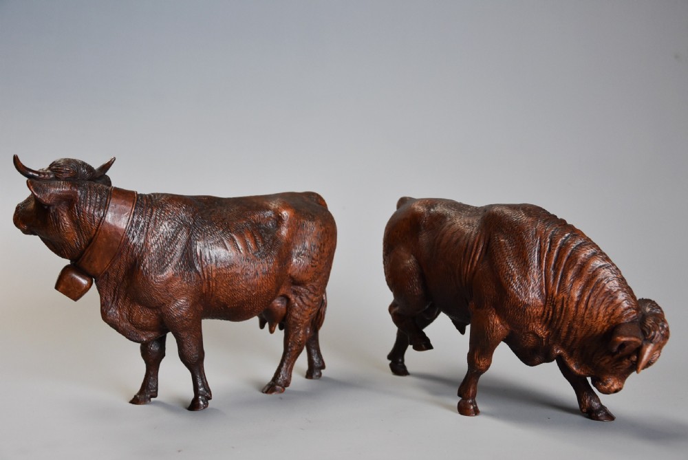 Pair of finely carved late 19th century linden wood Black Forest cows, possibly by The Huggler family View IV