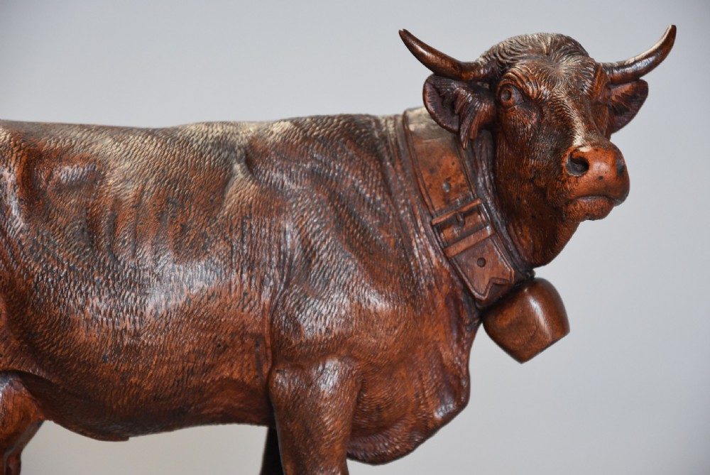 Pair of finely carved late 19th century linden wood Black Forest cows, possibly by The Huggler family View V
