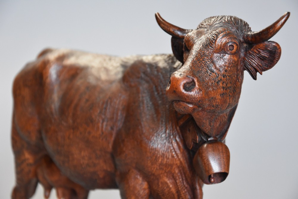 Pair of finely carved late 19th century linden wood Black Forest cows, possibly by The Huggler family View VI
