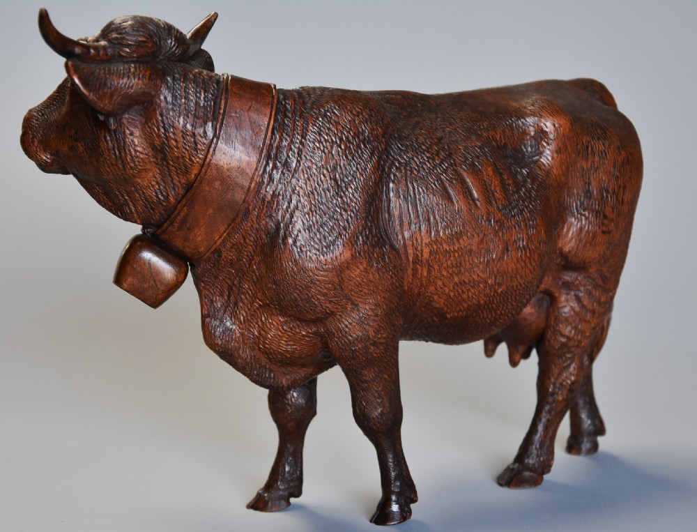 Pair of finely carved late 19th century linden wood Black Forest cows, possibly by The Huggler family View VIII