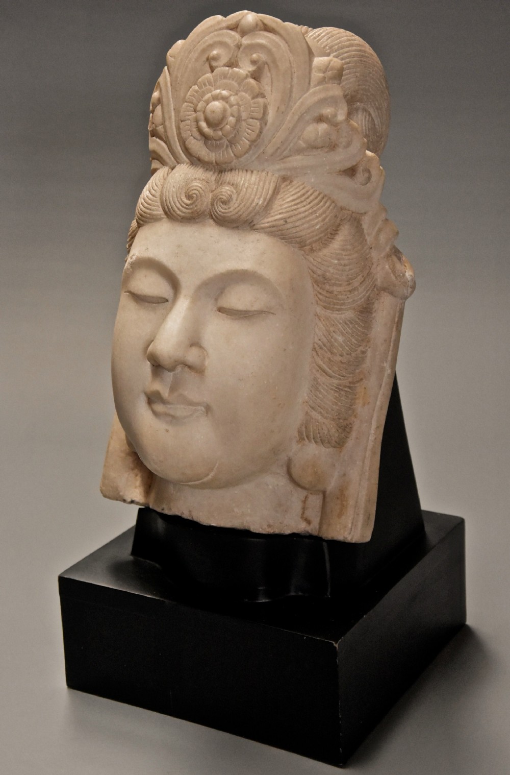 Late 19th century highly decorative carved marble head of Guan Yin