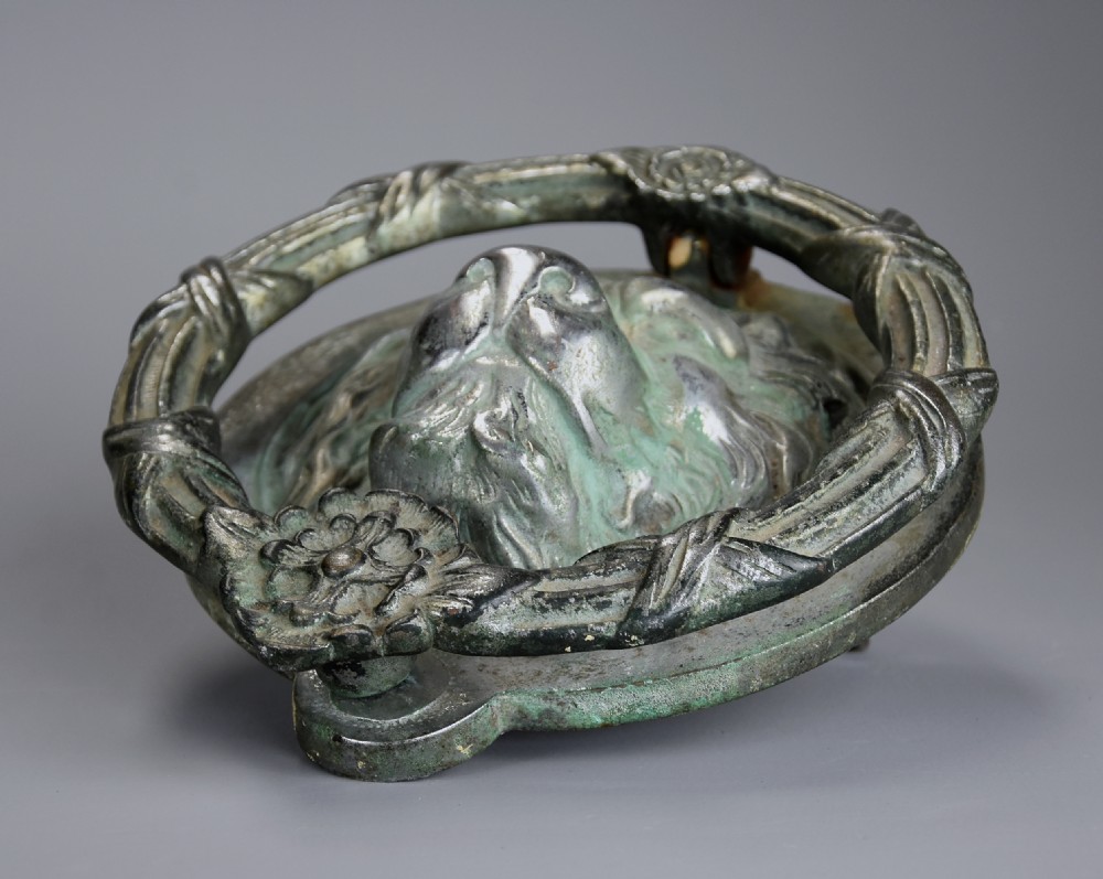 Regency bronze lion mask door knocker of large proprtions with verdigris patination View VII