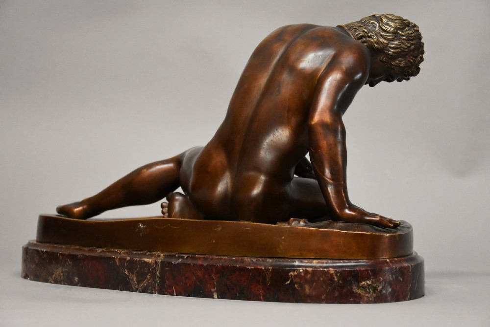 Late 19th century large Grand Tour bronze figure of 'The Dying Gaul' on marble base, after the antique View VI