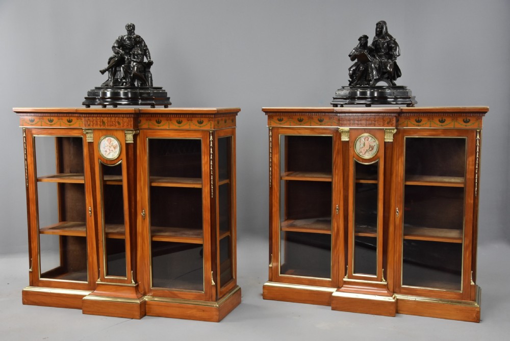 Superb pair of late 19thc Exhibition quality satinwood breakfront display cabinets