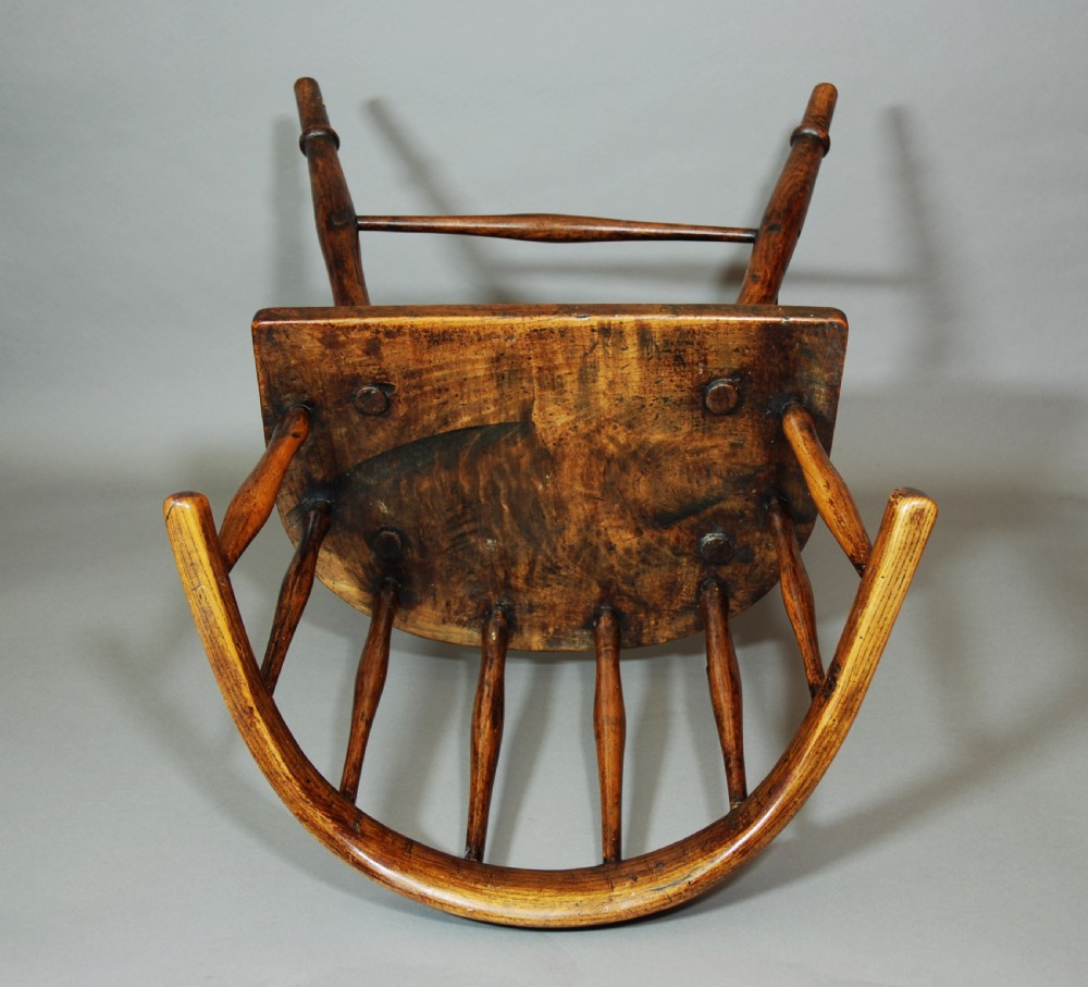 Charming early 19th century primitive hoop back ash Windsor child's chair of superb patina View V