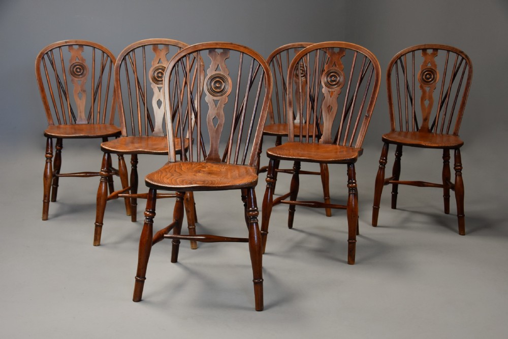 Rare set of six mid 19th century yew wood low back Windsor chairs of superb patina