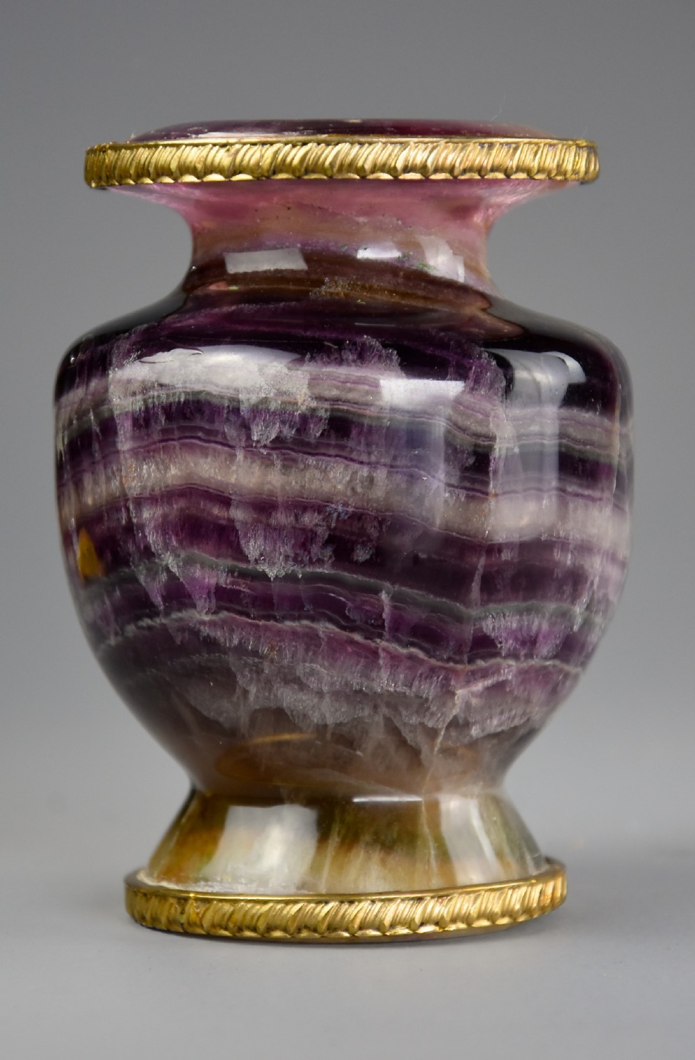Early 20th century Derbyshire Blue John vase of baluster form with gilt metal decoration