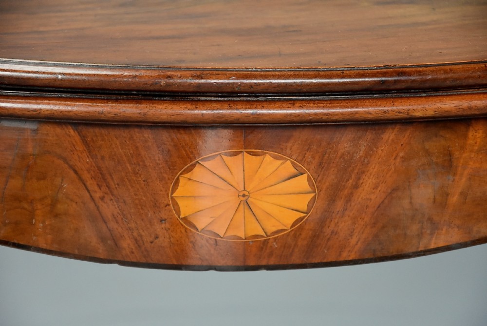 Elegant 18th century George III serpentine mahogany tea table of fine quality and patina View X