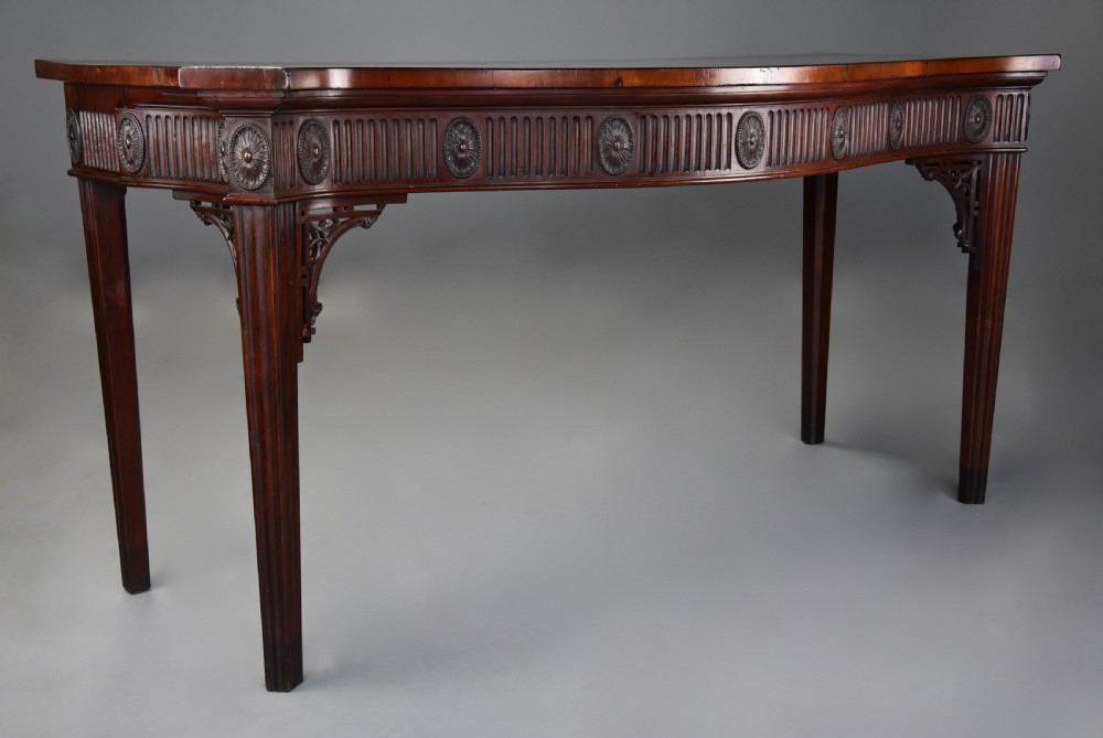 Late 19th century mahogany serpentine shaped serving or side table in the Adam style of fine patina