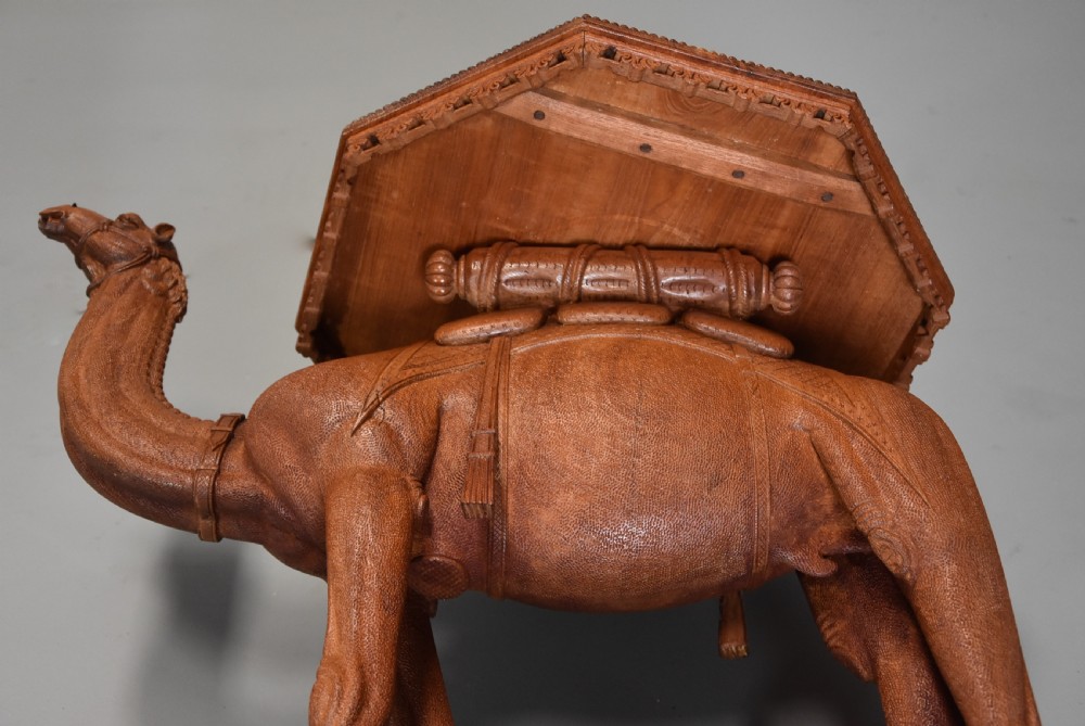 Superb quality late 19thc Anglo Indian hardwood camel table of good patina View XI