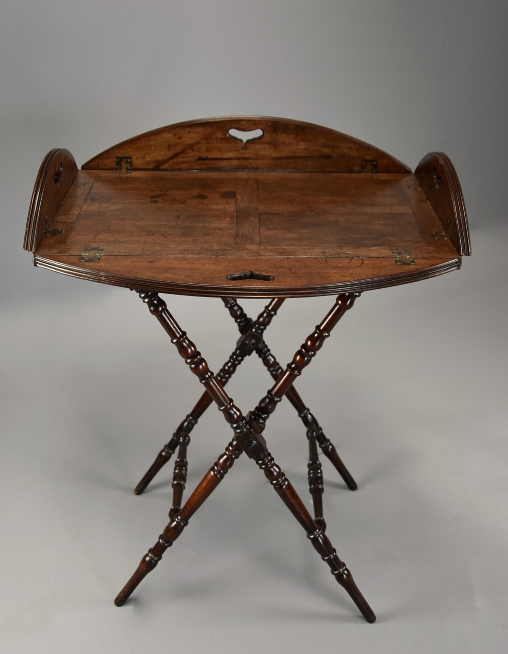 Late 18th century mahogany oval Butler’s tray on stand with superb original patina