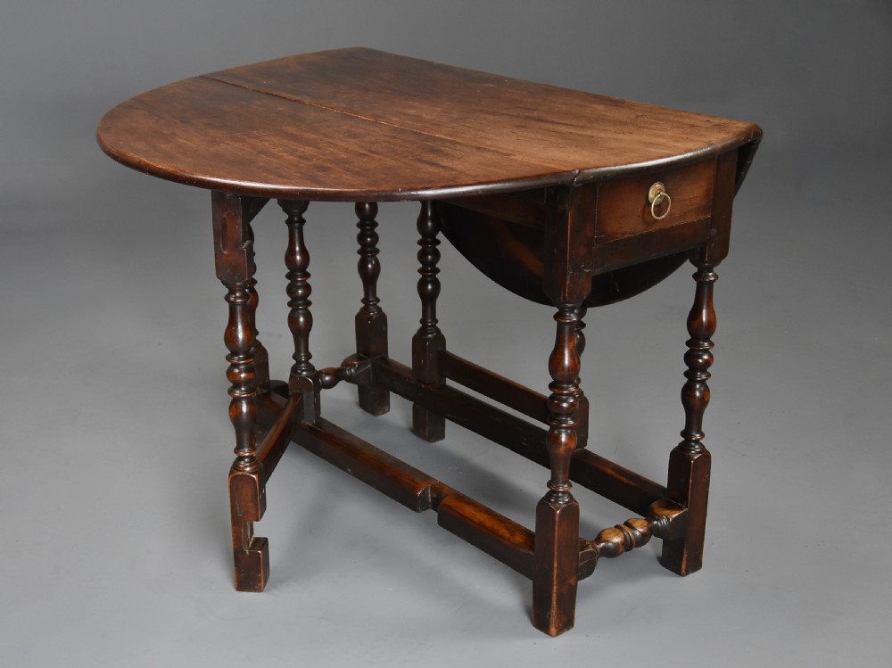 Rare late 17th century walnut gateleg table of superb patina View II