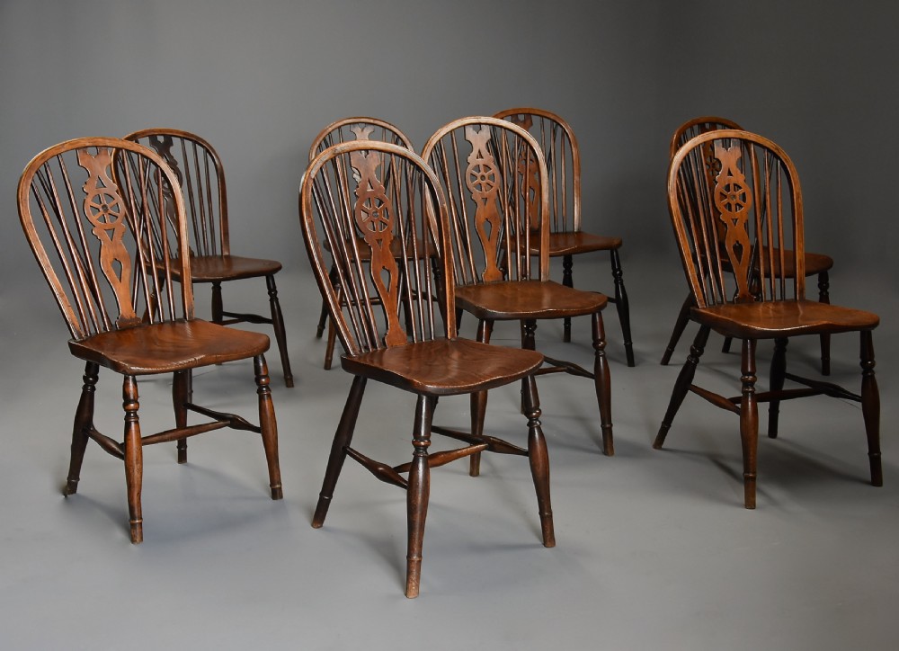 Harlequin set of eight mid 19th century ash and elm wheelback Windsor chairs of superb patina View II