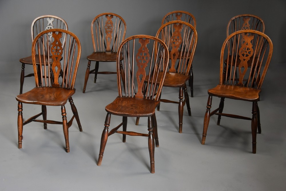 Harlequin set of eight mid 19th century ash and elm wheelback Windsor chairs of superb patina View III