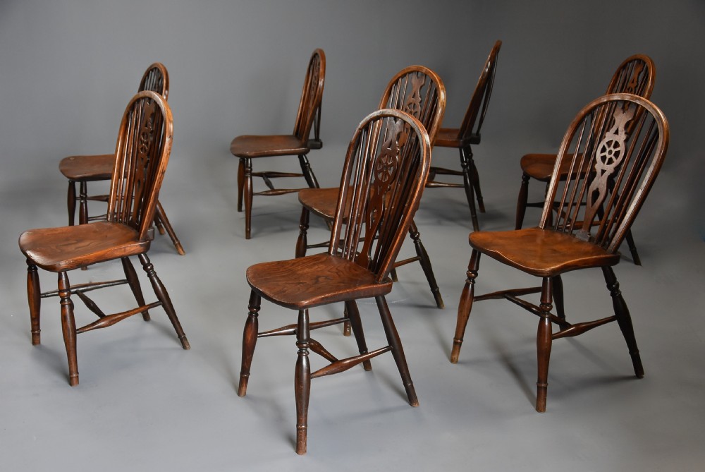 Harlequin set of eight mid 19th century ash and elm wheelback Windsor chairs of superb patina View IV