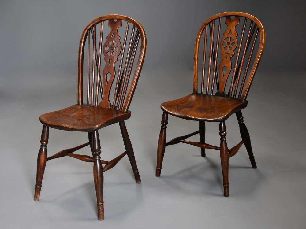 Harlequin set of eight mid 19th century ash and elm wheelback Windsor chairs of superb patina View VI