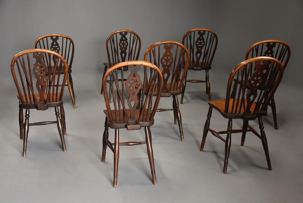 Harlequin set of eight mid 19th century ash and elm wheelback Windsor chairs of superb patina View XV
