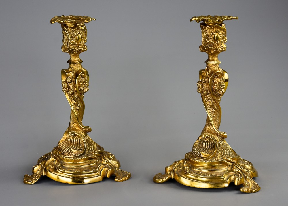 Pair of late 19th century French brass candlesticks in the Rococo style