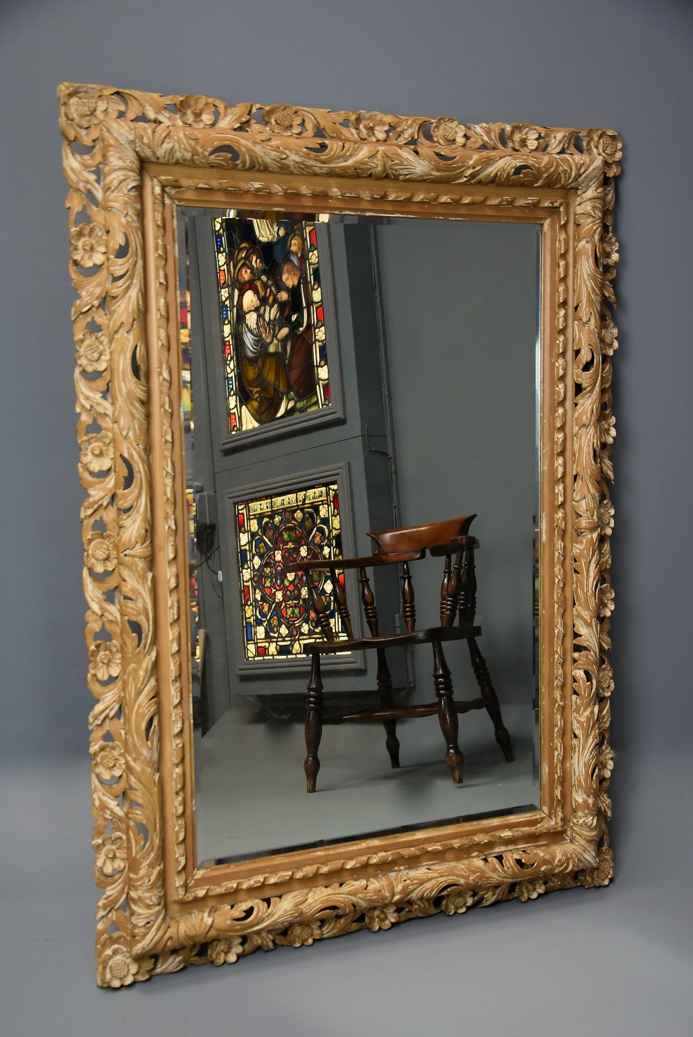 Large late 19th century Italian carved pine mirror with original bevelled glass