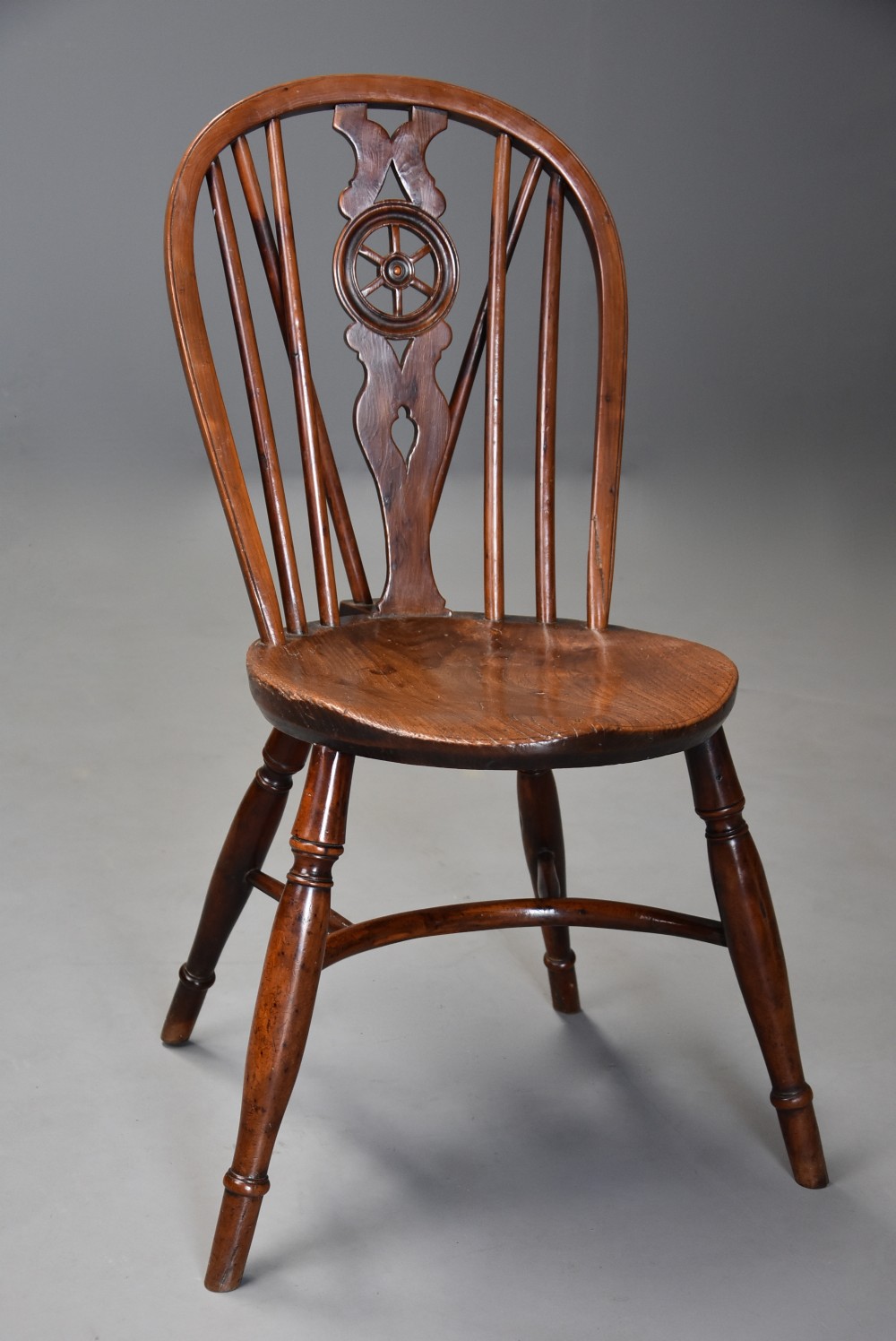 Rare early 19th century yew wood wheelback Windsor chair with excellent patina