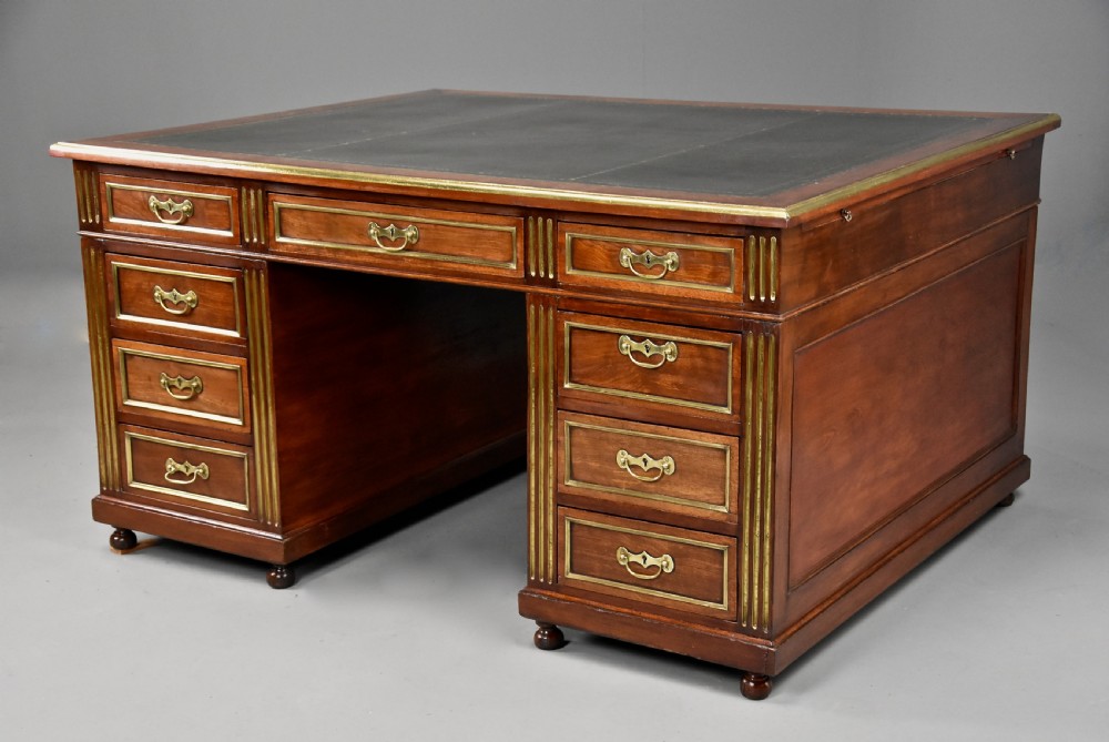 Late 19th century French mahogany partners desk in the Directoire style