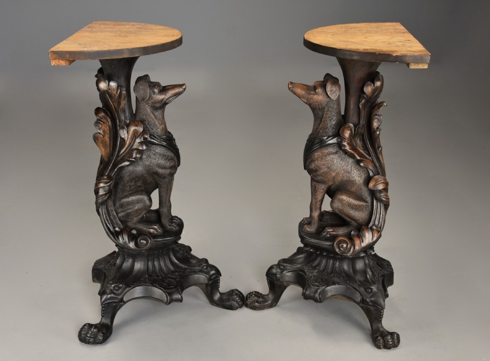 Pair of late 19th-century Black Forest demilune side tables featuring carved seated hound pedestals and white marble tops. View IX