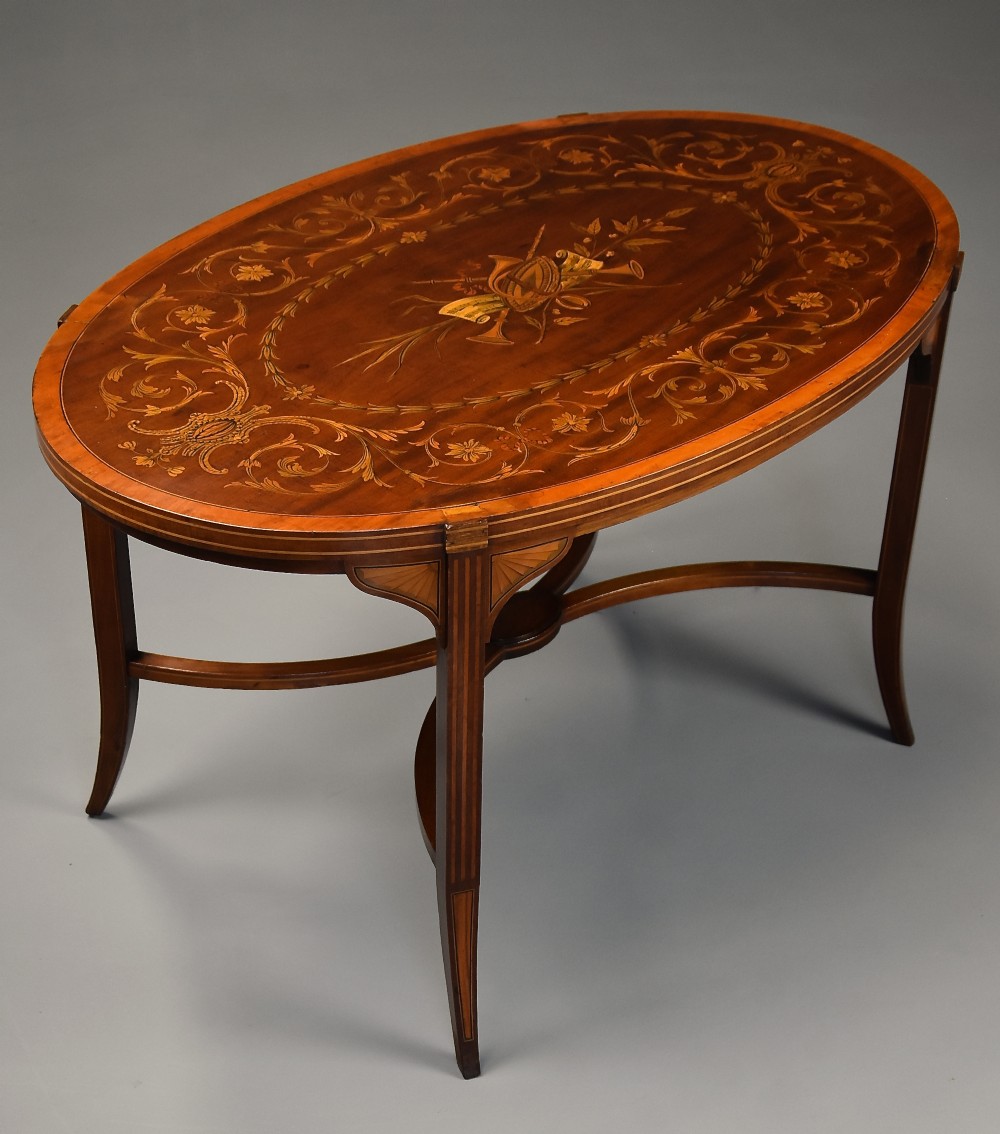 Fine quality Edwardian inlaid mahogany coffee table of oval form