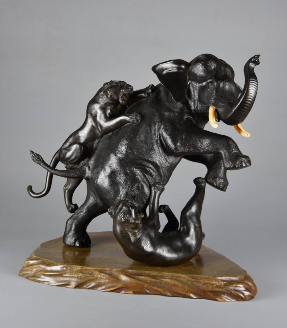 Large fine quality late 19th century Meiji Japanese bronze elephant & tiger group by animalier specialist Genryusai Seiya