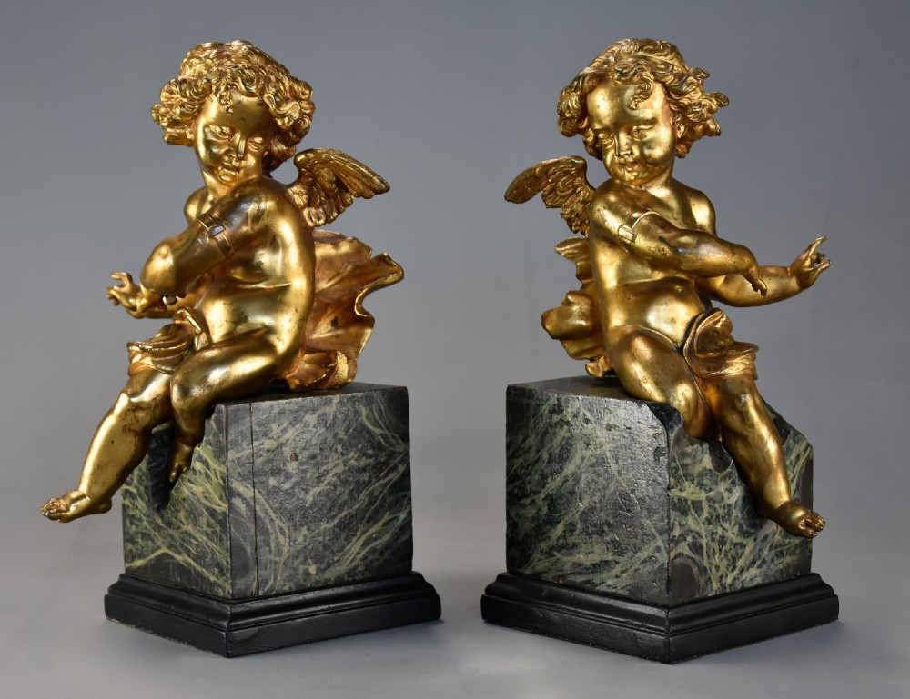 Pair of fine quality early 19th century French ormolu winged cherubs supported on faux marble bases